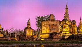 Iconic Ayutthaya ruins at sunset for a vibrant Ayutthaya Tours banner with Legend Travel Group.
